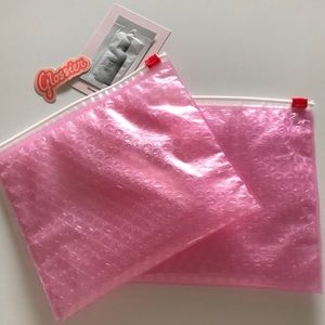 2 glossier pink zip pouches / bags